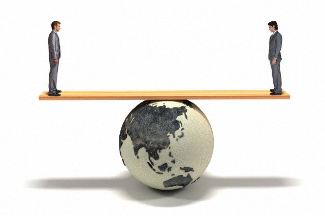 Business Man with Globe --- Image by © Sung-Il Kim/Corbis